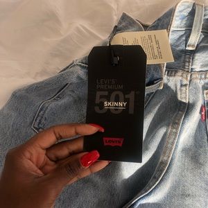 Levi skinny 501 jeans. Never worn. No rip.